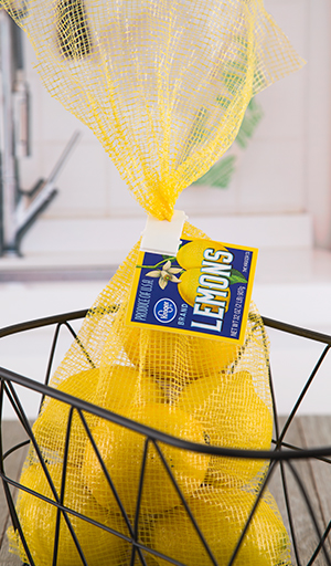 Custom product tags for lemons attached to plastic bag clip